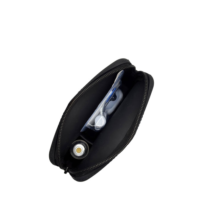 Top image showing inside of the case: A top-down view of the inside of the black Omnipod® protective travel case, showcasing the compartments and how items like an Omnipod® pod and insulin vial are stored in an organized manner.