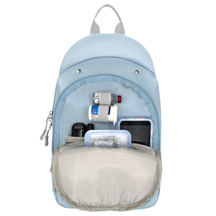 A light blue medical-style backpack shown open against a white background, with its front pocket expanded to display storage compartments containing diabetes and Omnipod supplies.