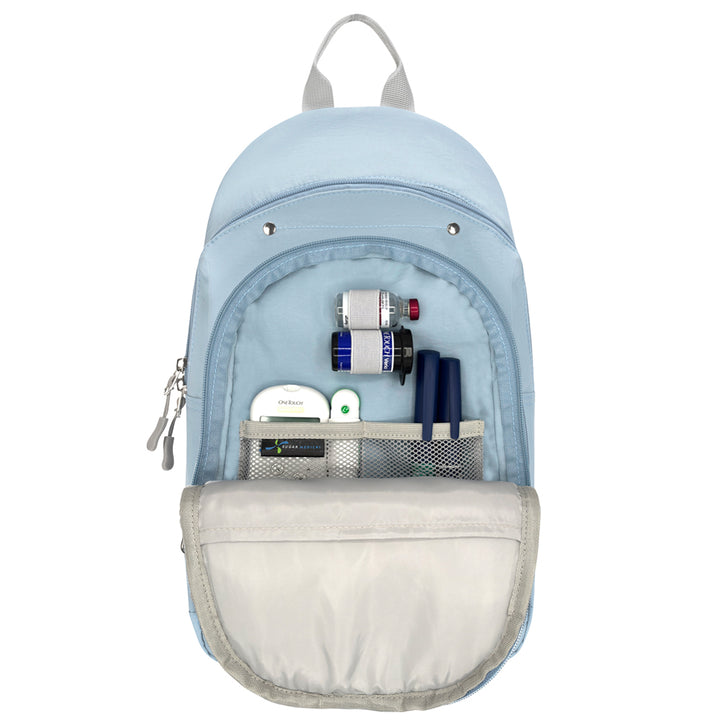A light blue backpack shown open against a white background, with its front pocket expanded to display storage compartments and diabetes supplies inside.