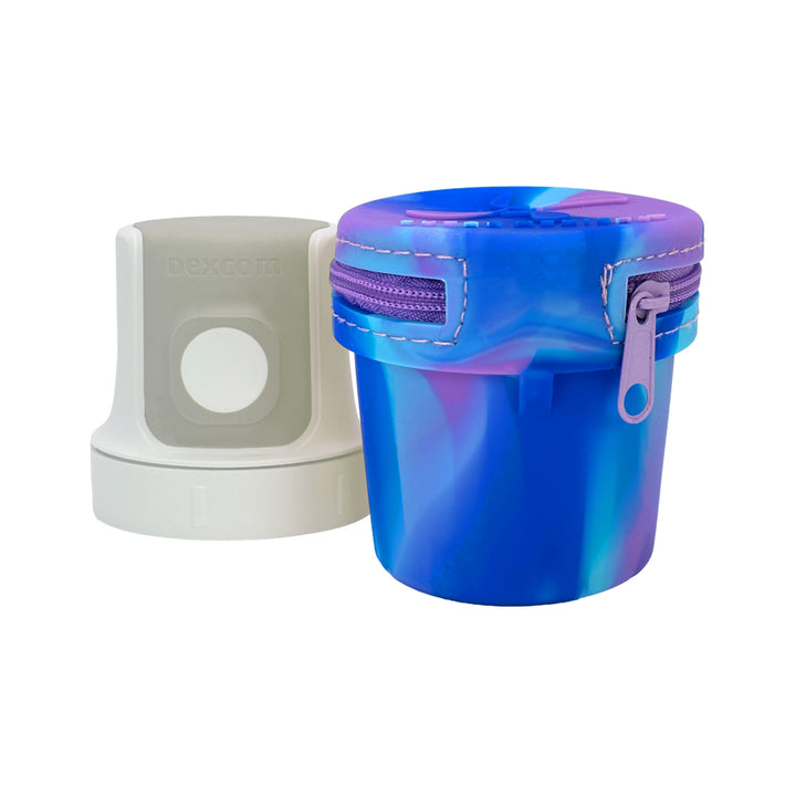 Blue Purple Dexcom G7 Protective Travel Case with Dexcom 7 inserter next to it.