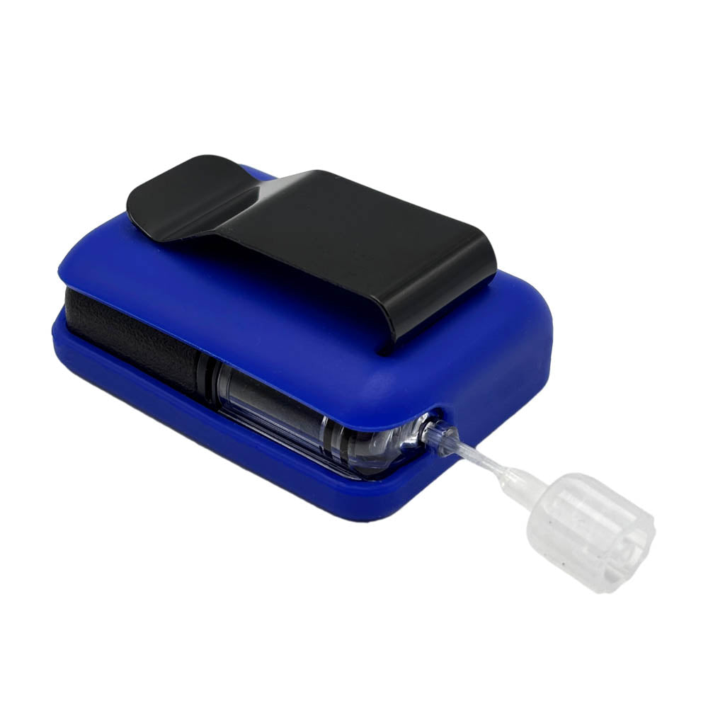 Bue Tandem Mobi EZ-To-Charge Clip with Mobi insulin pump inside the case, laying flat on a surface.
