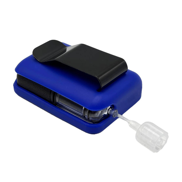 Bue Tandem Mobi EZ-To-Charge Clip with Mobi insulin pump inside the case, laying flat on a surface.