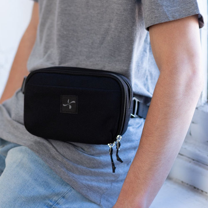 Diabetes Insulated Convertible Belt Bag in black around man’s waist.