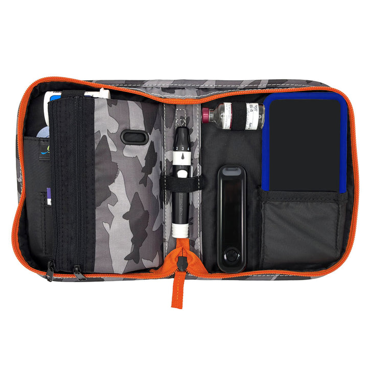 Inside of the Omnipod supply case with a specially designed loop for insulin vial, pocket for Omnipod 5 device, loop for lancing device, test strip trash can and spot to secure glucose meter. 