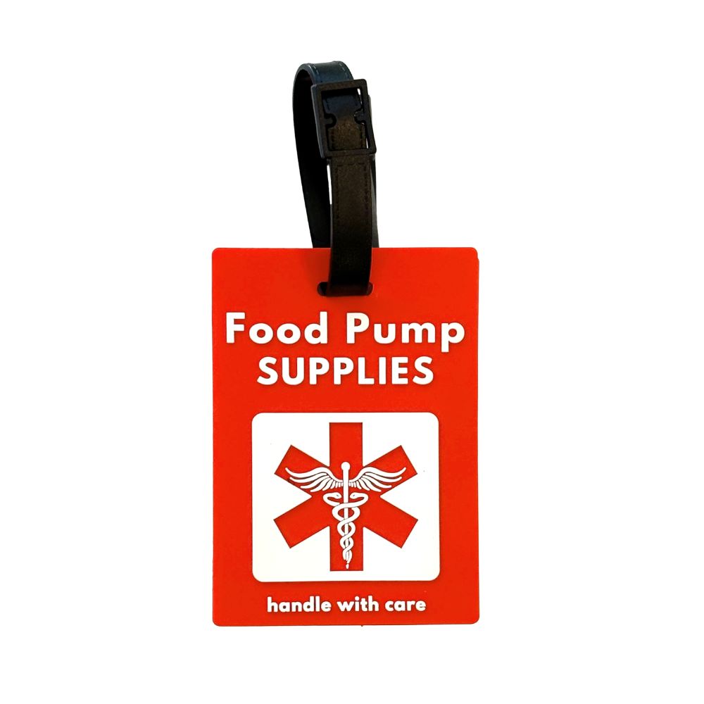 A red luggage tag with a black strap, featuring the text 'Food Pump SUPPLIES' and a red and white medical-style symbol on a white background.