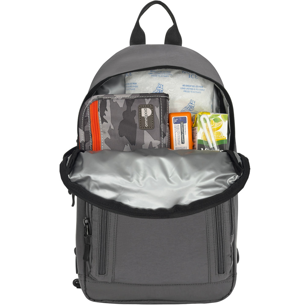 A gray backpack shown open from the front, revealing its interior compartments filled with travel items such as a camouflage wallet, first-aid kit, and other small accessories. The backpack has a silver-gray interior lining and black trim.