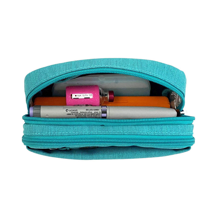 Diabetes Insulated Convertible Belt Bag in turquoise back insulated compartment with ice pack, insulin pens and insulin vial. 