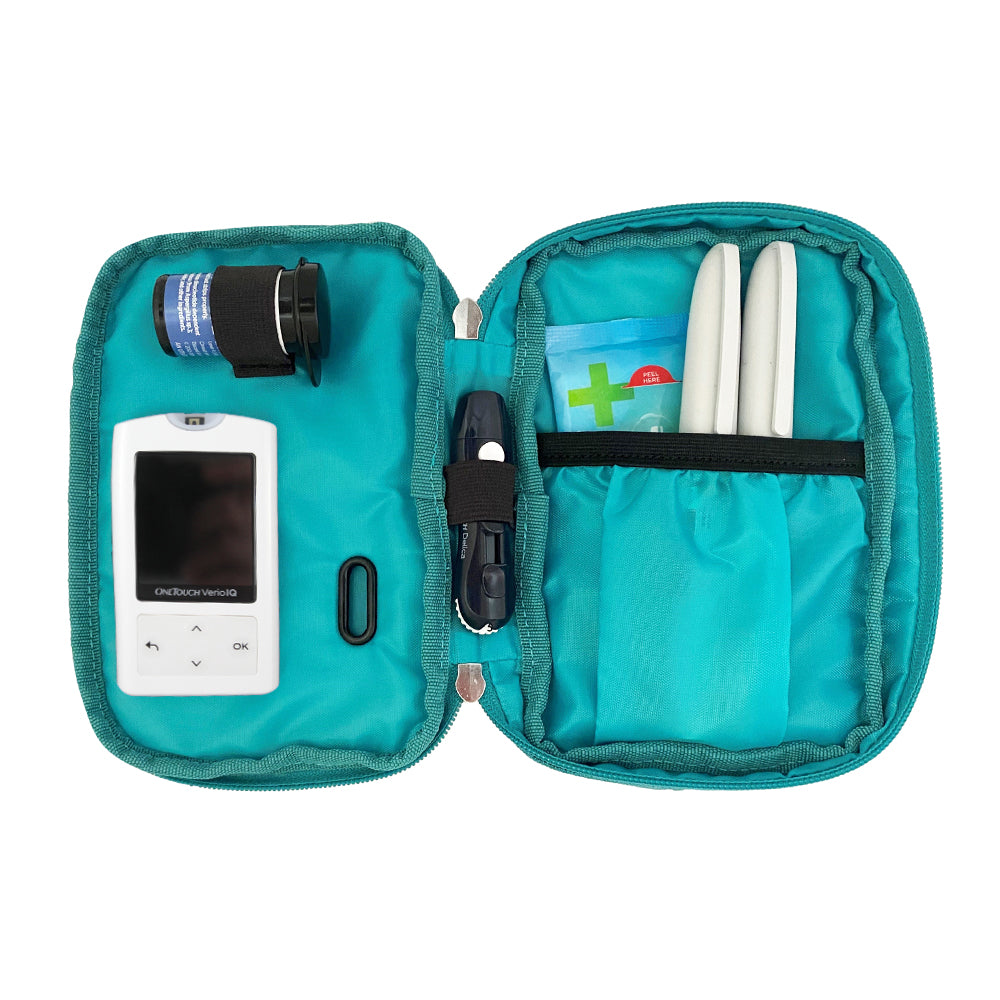 Diabetes Insulated Convertible Belt Bag in turquoise inside set up with glucose meter, test strips, lancet, insulin pens and and wipes. 