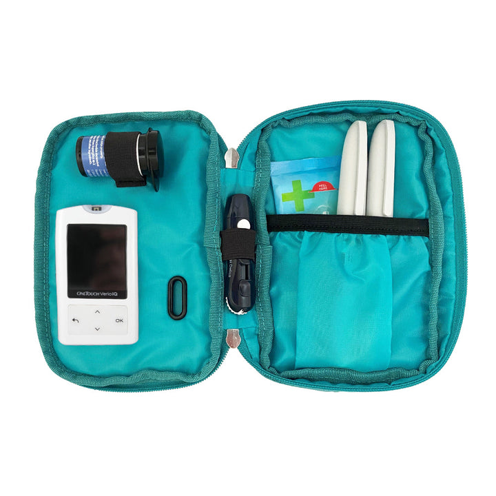 Diabetes Insulated Convertible Bag in Turquoise inside set up with glucose meter, test strips, lancet and insulin pens. 