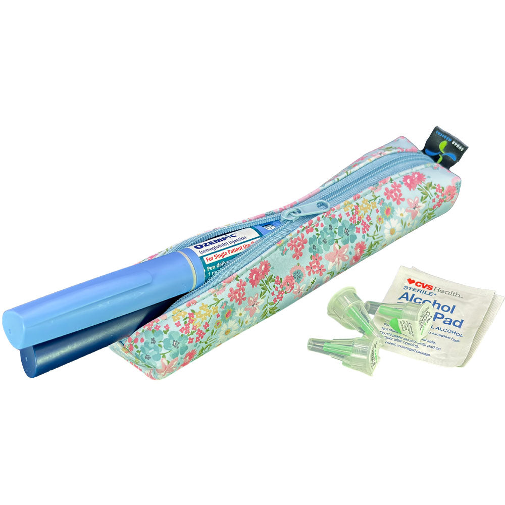 Floral-patterned MedMate GLP-1 / Insulin Pen Case with a blue zipper open with GLP-1 pen coming out. 