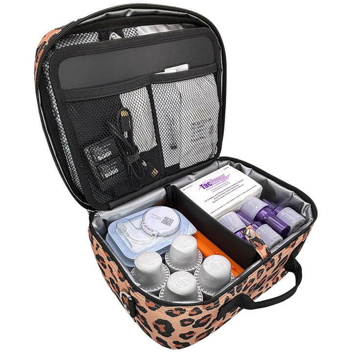 An open leopard-print diabetes travel bag filled twiist diabetes supplies, shown on a solid white background.
