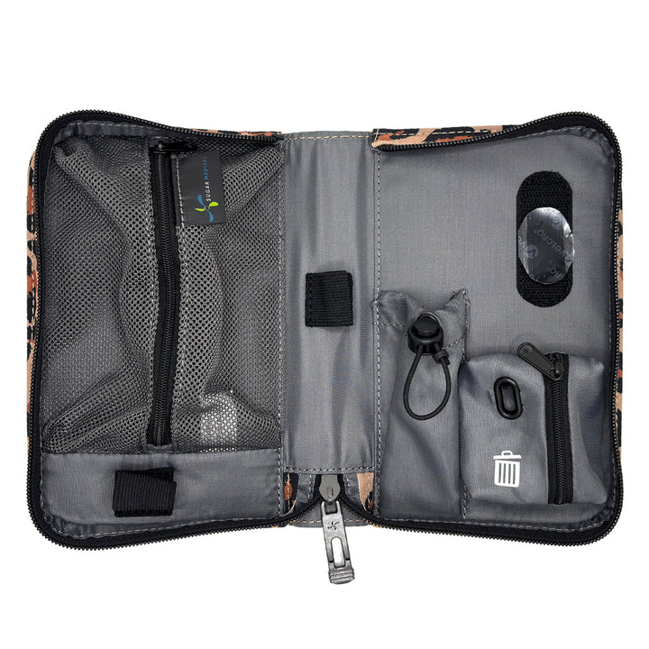 An open gray and black organizer pouch with multiple compartments, mesh pockets, elastic loops, and a small trash-compacting pocket, shown on a white background.