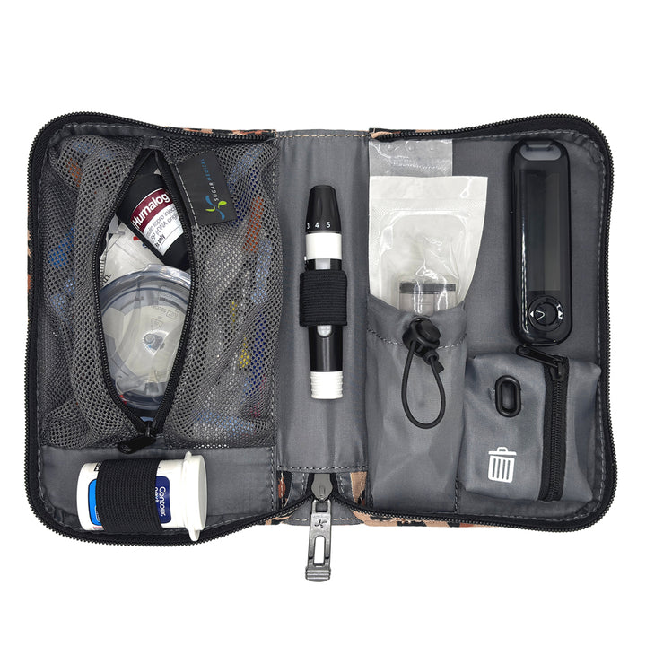 An open gray and black diabetes management kit organizer bag, showing its interior compartments filled with a blood glucose meter, test strips, a lancet, a small bottle, and other medical supplies on a white background.