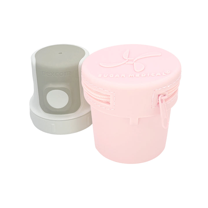 Front of light pink G7 Protective Travel Case with Dexcom 7 inserter next to it.