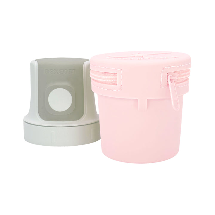 Light pInk of blue Dexcom G7 Protective Travel Case with Dexcom 7 inserter next to it.