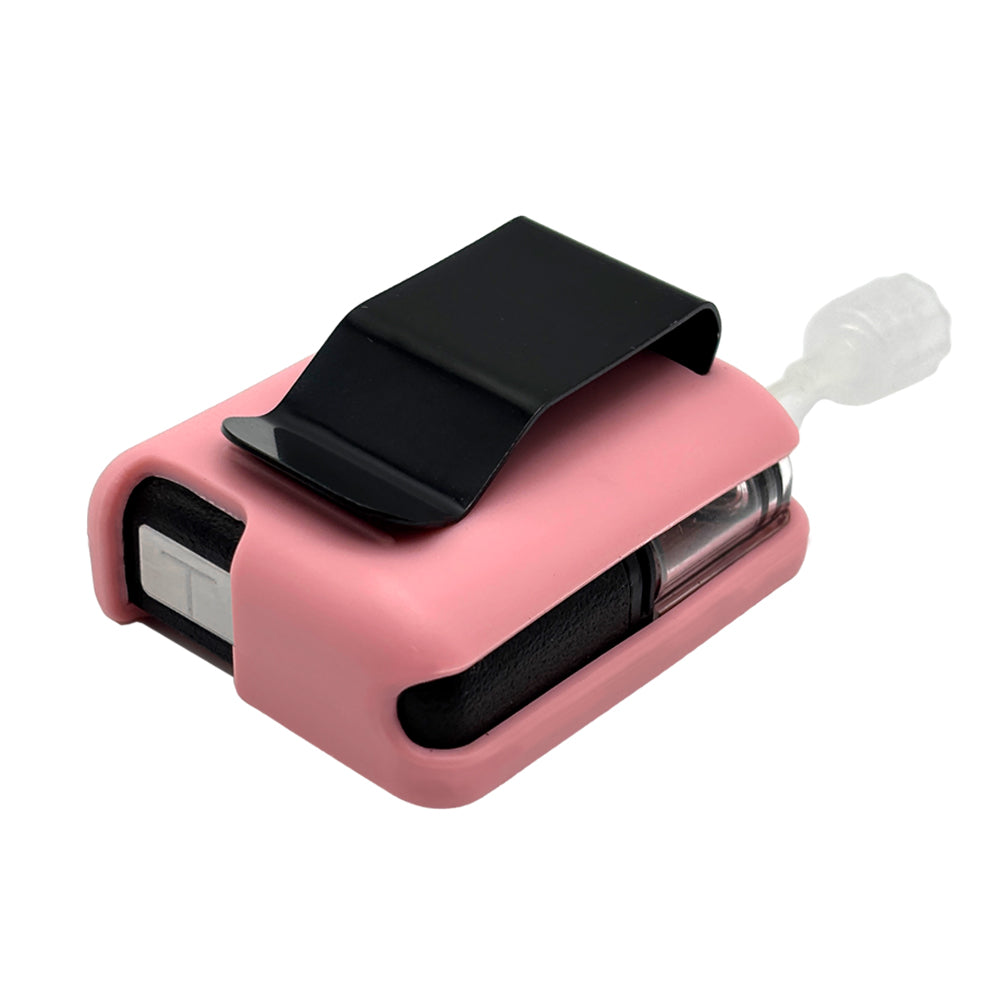 Pink Tandem Mobi EZ-To-Charge Clip with Mobi insulin pump inside the case, laying flat on a surface.
