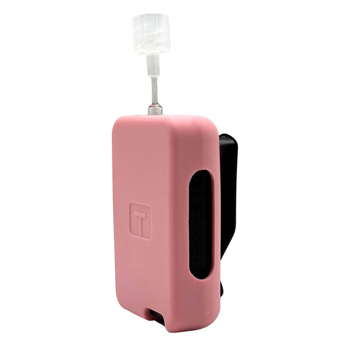 Pink Tandem Mobi EZ-To-Charge Clip with Mobi insulin pump inside the case, standing straight up tilted to left. 
