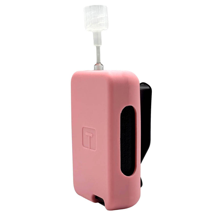 Pink Tandem Mobi EZ-To-Charge Clip with Mobi insulin pump inside the case, standing straight up tilted to left. 