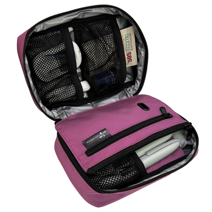 The front section of the orchid diabetes organizer has three mesh pockets to secure your diabetic supplies