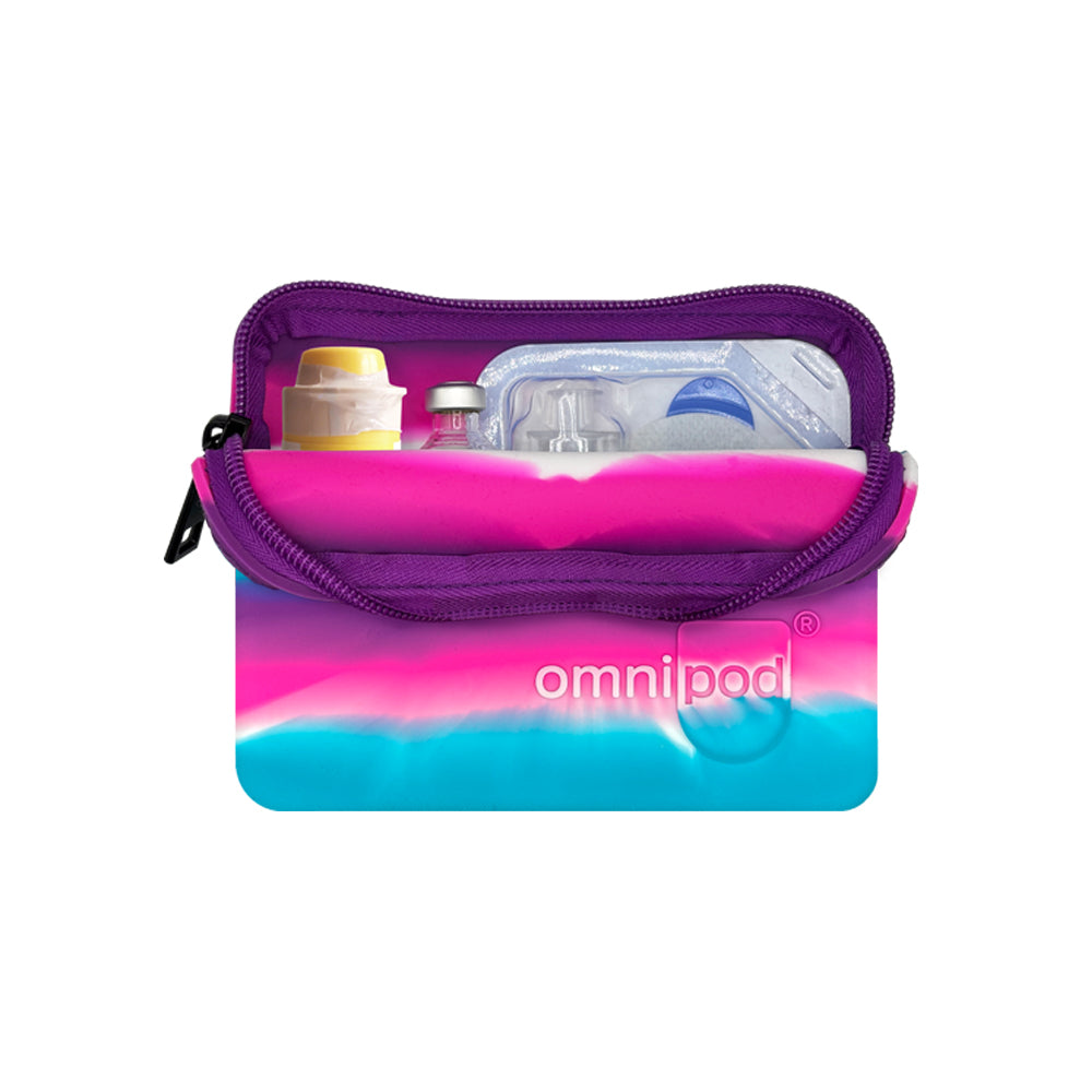 Set up with Omnipod® pod, insulin and Baqsimi nasal glucagon: The interior of the pink, purple, blue and white stripe Omnipod® protective travel case showing an Omnipod® pod, insulin vial and a Baqsimi nasal glucagon arranged neatly within the case.