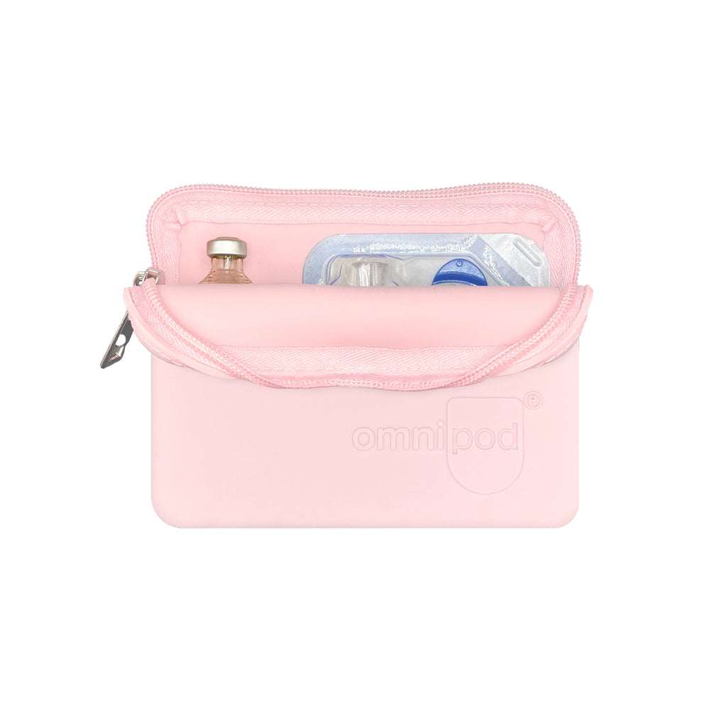 Set up with Omnipod® pod and insulin: The light pink Omnipod® protective travel case opened to reveal an Omnipod® insulin pod and an insulin vial placed inside, demonstrating the case's organized storage capabilities.