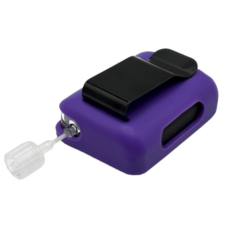 Purple Tandem Mobi EZ-To-Charge Clip with Mobi insulin pump inside the case, laying flat on a surface.