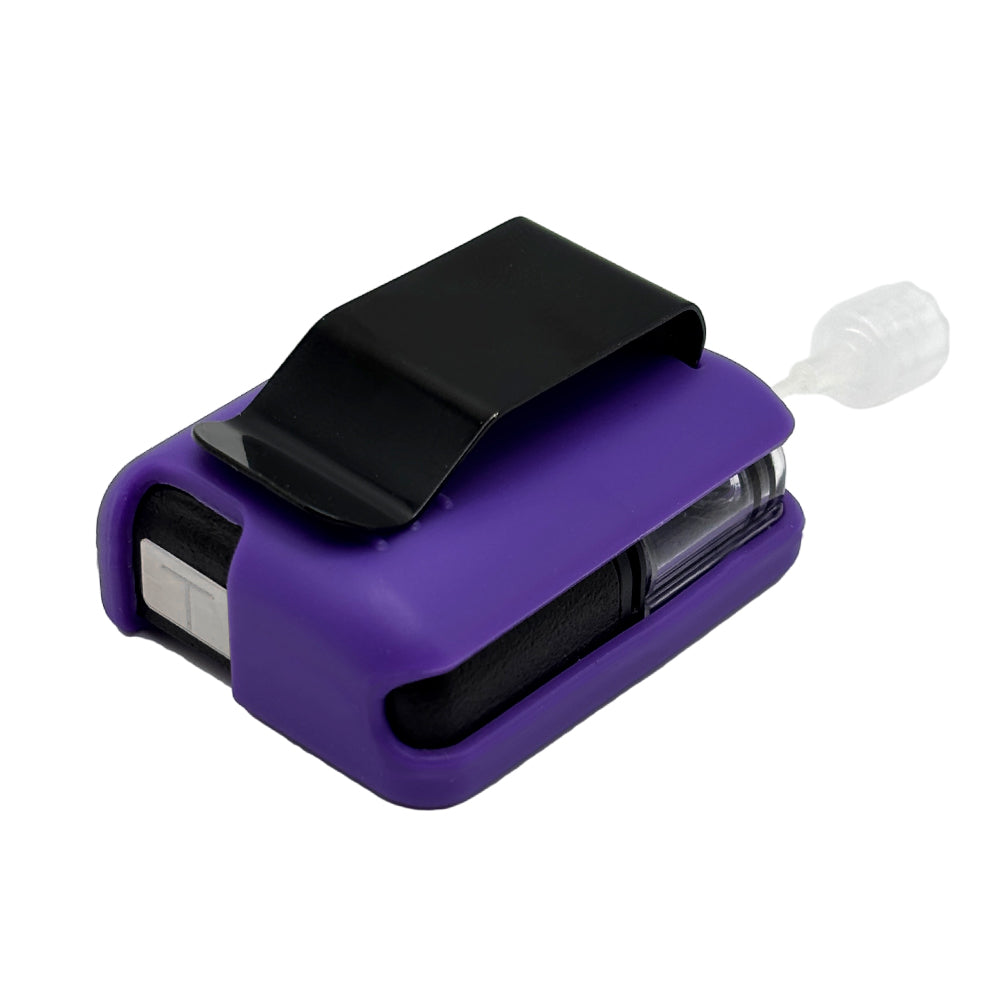 Purple Tandem Mobi EZ-To-Charge Clip with Mobi insulin pump inside the case, laying flat on a surface.
