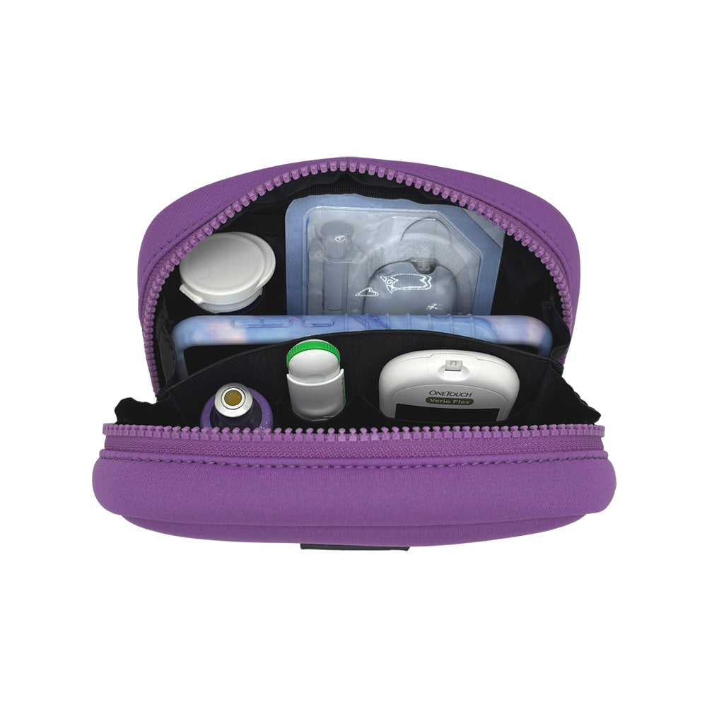 Open view of the Omnipod® Metro Supply Case in purple, displaying neatly organized Omnipod® PDM, pod, and other diabetes supplies inside the case.