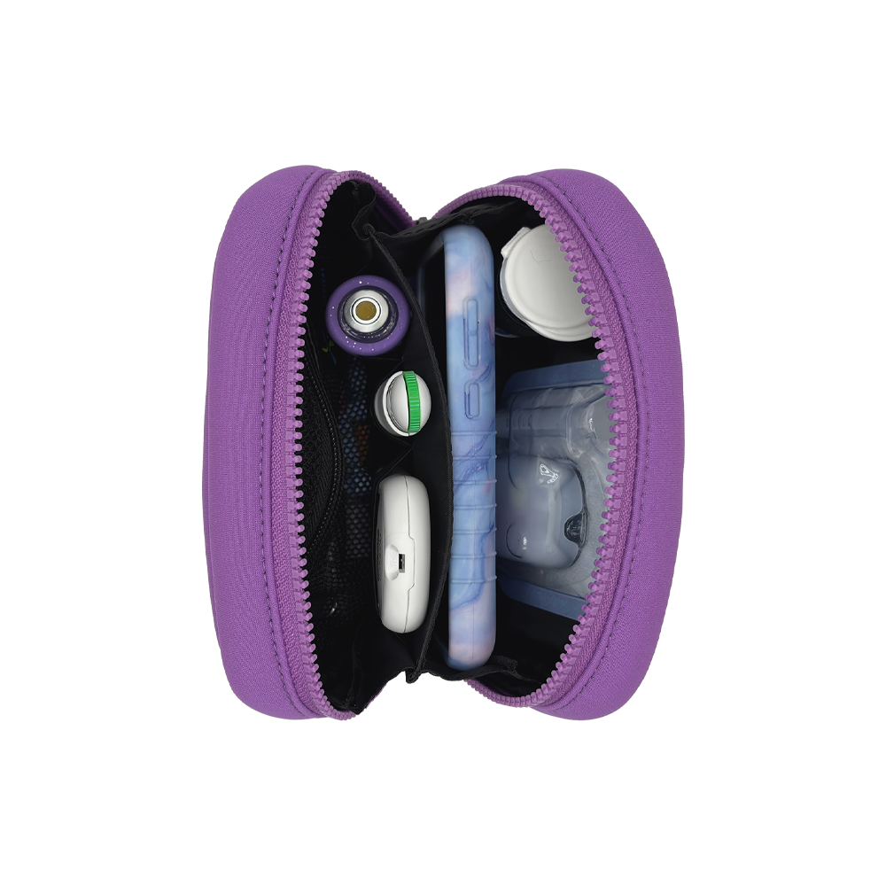 Vertical view of the Omnipod® Metro Supply Case in purple, displaying neatly organized Omnipod® PDM, pod, and other diabetes supplies inside the case.