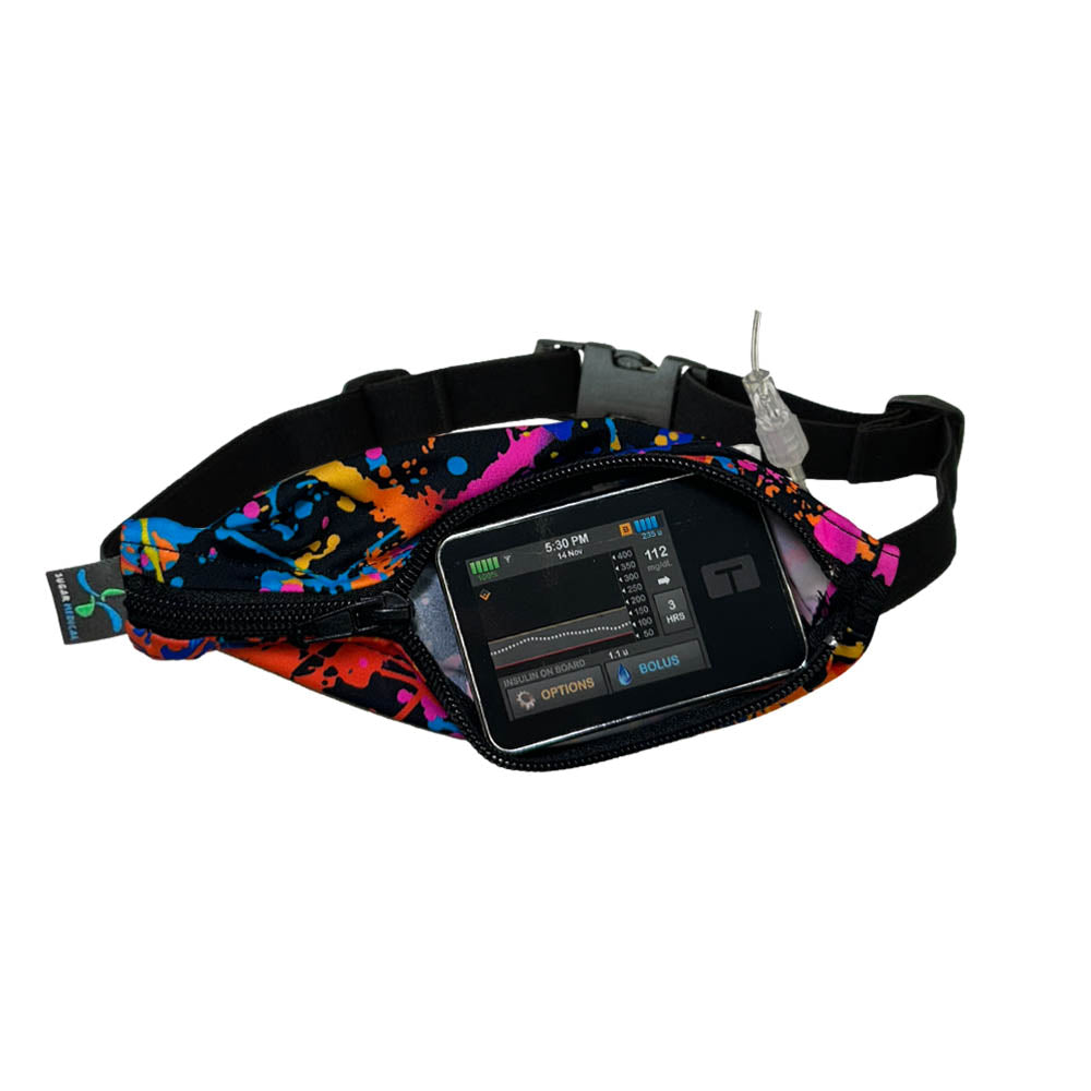 Kids rave SPI belt open with Tandem pump inside and tubbing coming out the side hole.