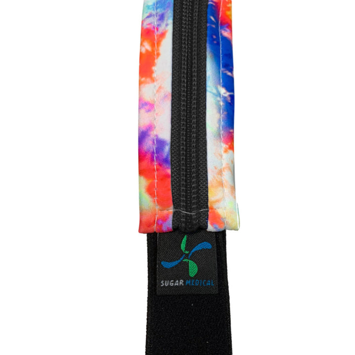 Close up of the vibrant colors of the tie dye and the sugar medical logo on the diabetes waist band.