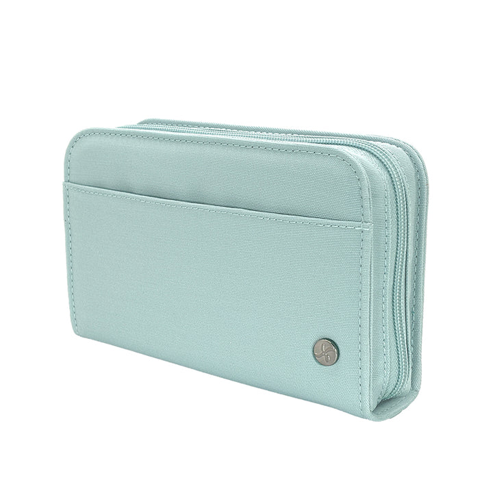 A light mint green diabetes supply case with a small round silver logo button, shown on a plain white background.