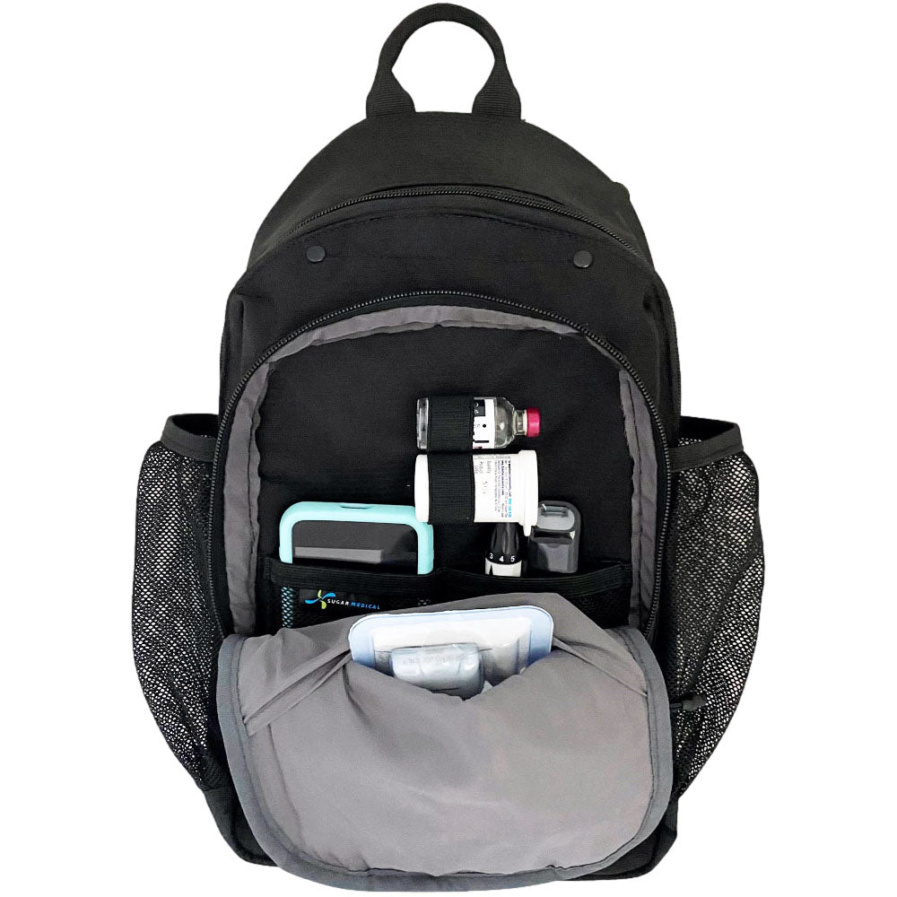 Diabetes Insulated Sling Backpack in black front compartment set up with Omnipod 5 PDM, glucose meter, test strips, extra POD and lancet. 