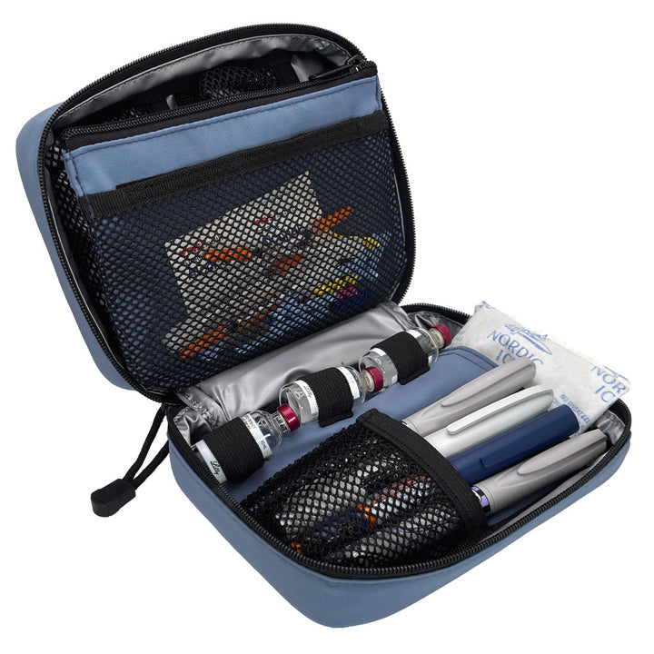 The back section of the steel blue diabetes organizer has three loops to secure insulin vials and mesh pocket that fits four insulin pens.