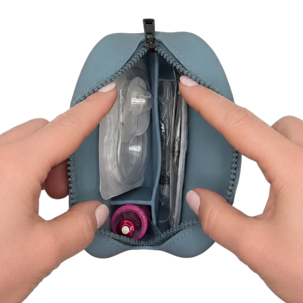 Aqua Tandem Protective Travel Case with Tandem supplies, held open by hands on a white background