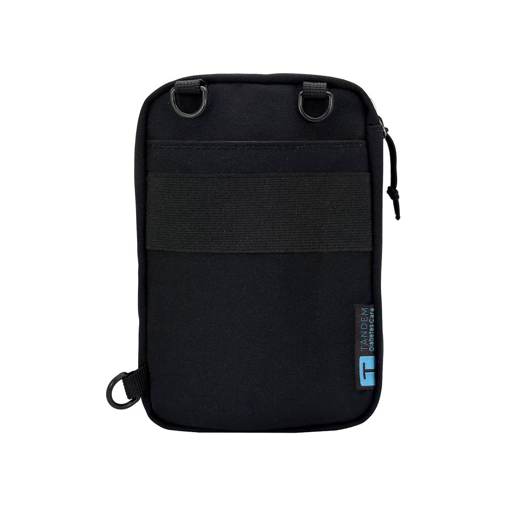 Back of black tandem diabetes supply case with a visible brand logo on a white background