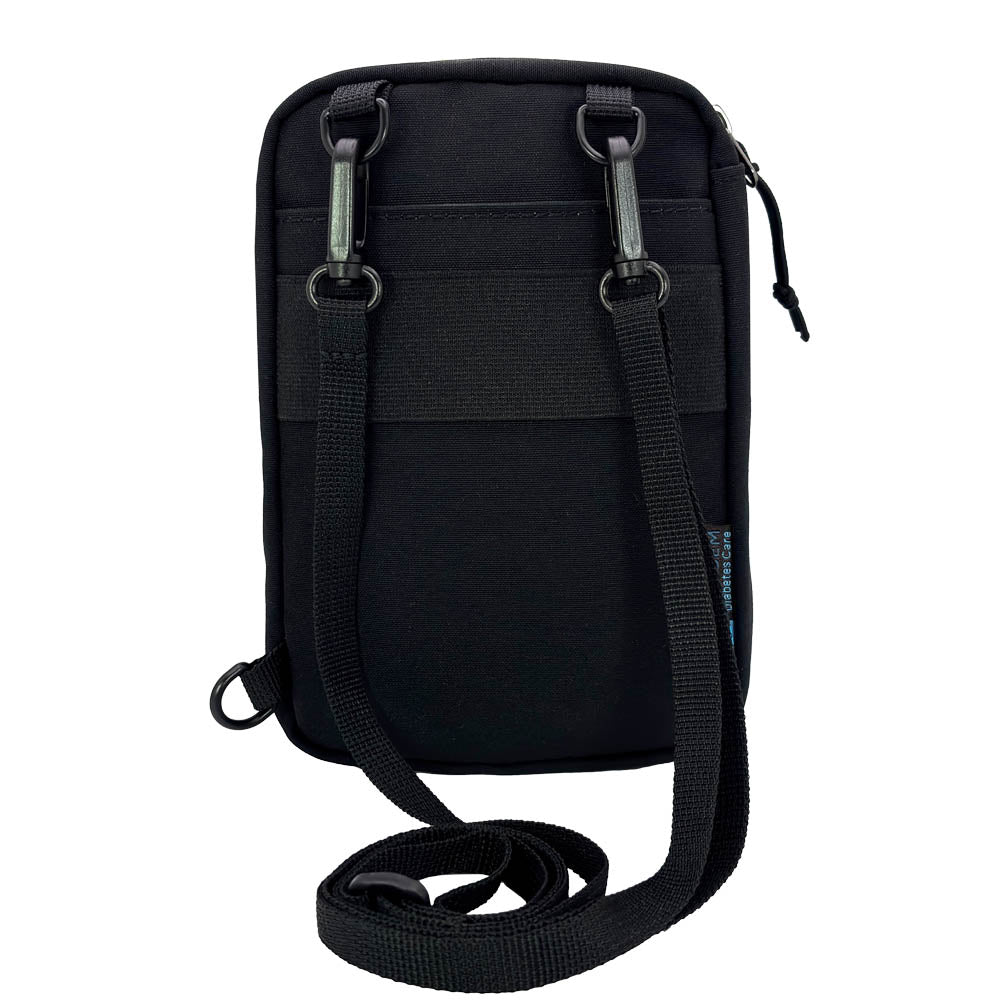Back of a Black tandem diabetes supply case with a strap on a white background