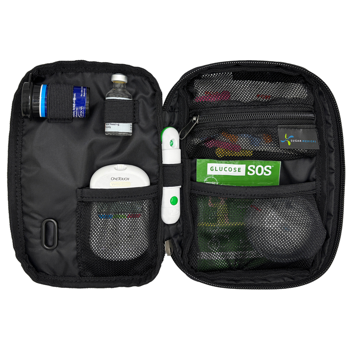 Black tandem diabetes supply case with glucose testing supplies on a white background