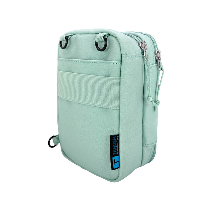 Seafoam tandem diabetes supply case crossbody bag with a blue Tandem logo on a white background
