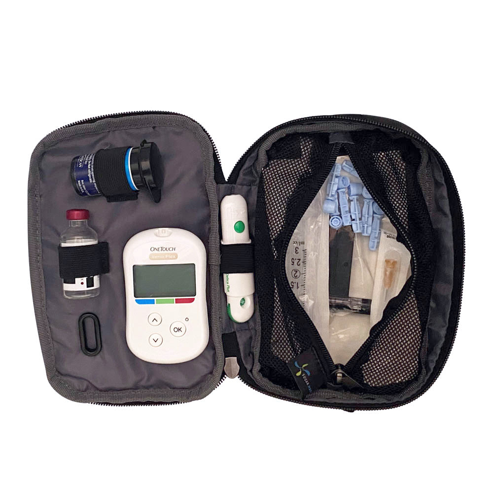 Tandem supply case in black opened flat with inside set up containing glucose meter, test strips, lancet, and insulin vial on the left and a mesh pocket on the right with extra supplies.