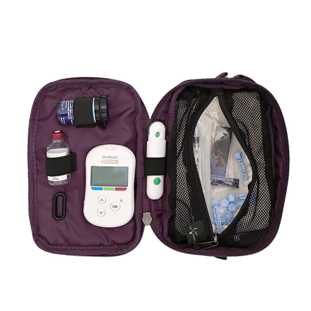 Tandem supply case in deep purple opened flat with inside set up containing glucose meter, test strips, lancet, and insulin vial on the left and a large mesh pocket on the right with extra supplies.