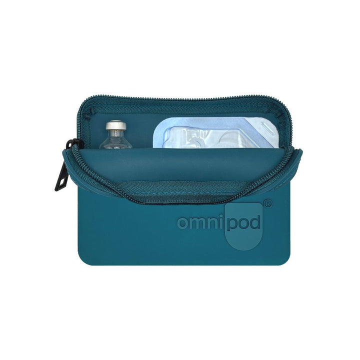 Set up with Omnipod® pod and insulin: The blue Omnipod® protective travel case opened to reveal an Omnipod® insulin pod and an insulin vial placed inside, demonstrating the case's organized storage capabilities