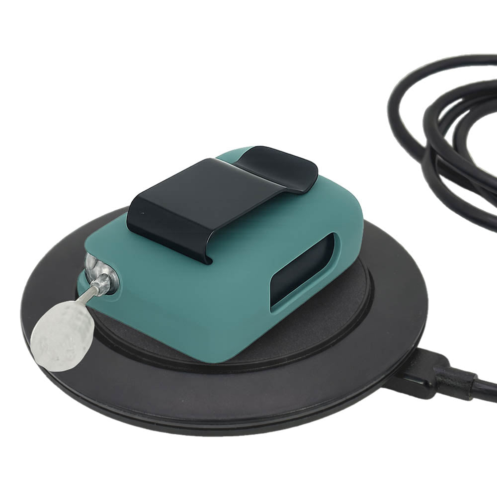 Teal Mist Tandem Mobi EZ-To-Charge Clip with Mobi insulin pump inside the case, lying flat on charger.