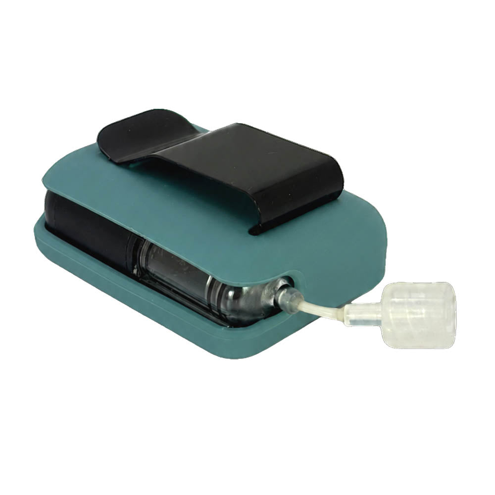 Teal Mist Tandem Mobi EZ-To-Charge Clip with Mobi insulin pump inside the case, laying flat on a surface.