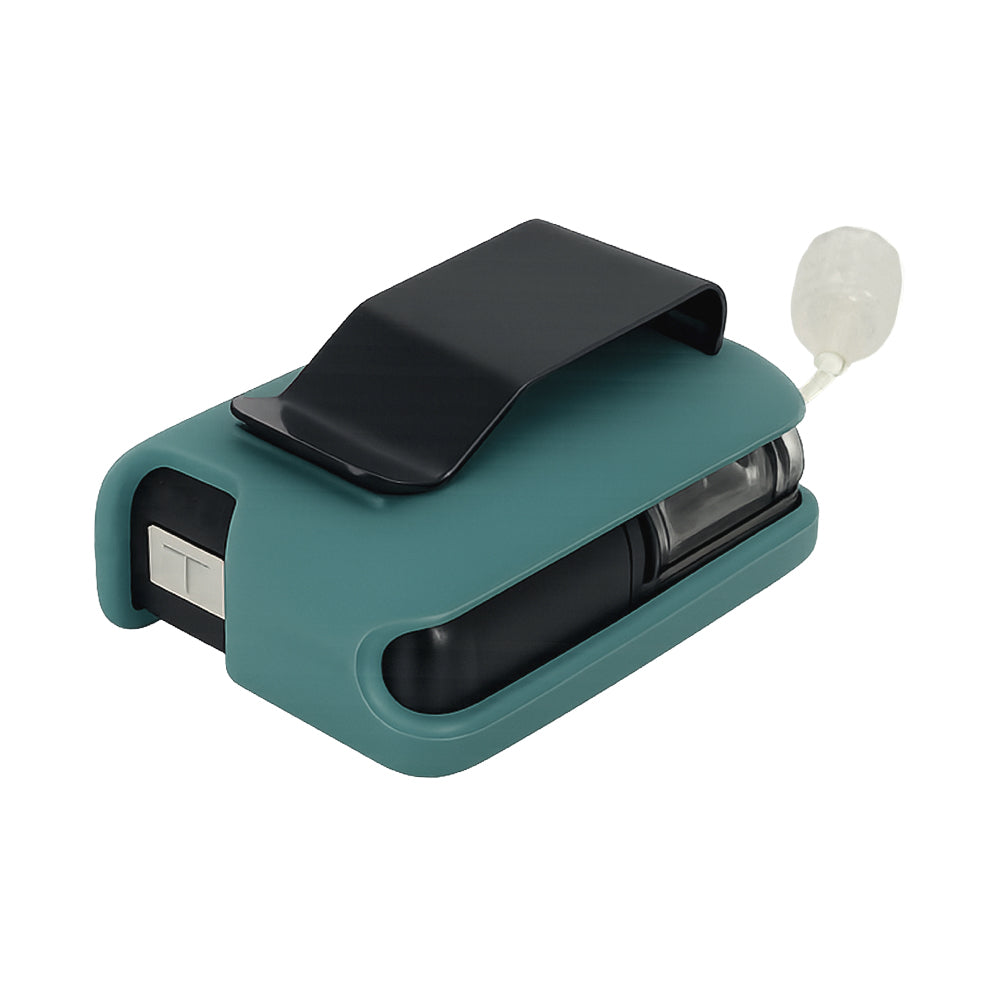 Teal Mist Tandem Mobi EZ-To-Charge Clip with Mobi insulin pump inside the case, lying flat on a surface.