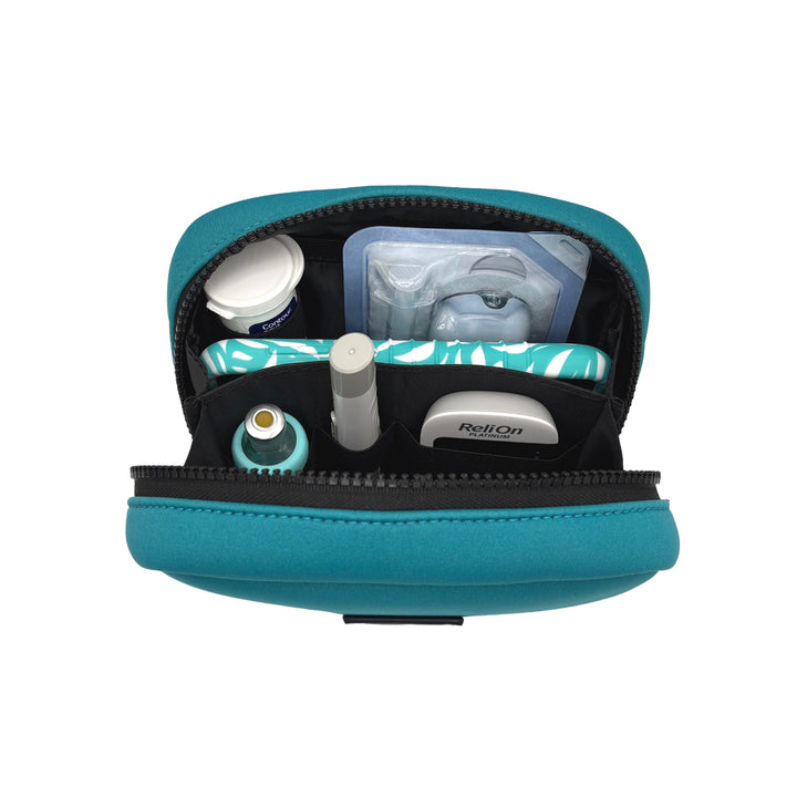 Open view of the Omnipod® Metro Supply Case in teal, displaying neatly organized Omnipod® PDM, pod, and other diabetes supplies inside the case.