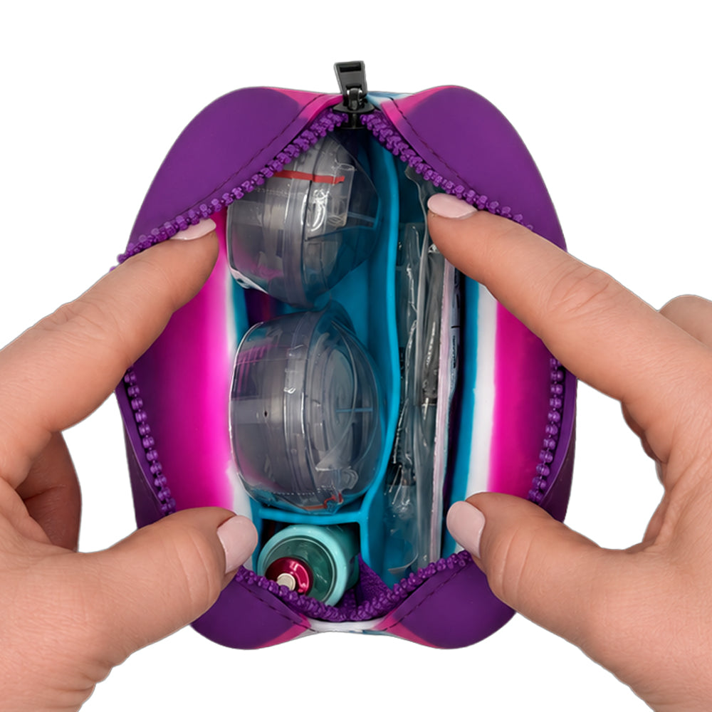 Purple, Pink and Blue Tandem Protective Travel Case with Tandem supplies, held open by hands on a white background