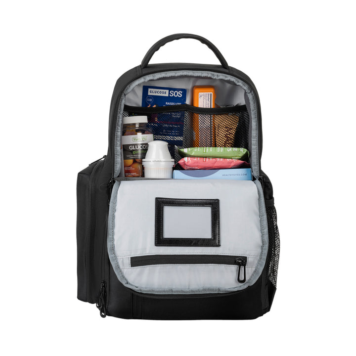 Black Travel Backpack top pocket open with book, diabetic supply bag, clothes and mesh pocket with chargers. 