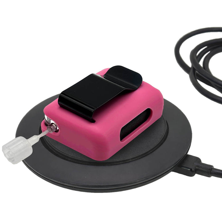 Very Berry Tandem Mobi EZ-To-Charge Clip with Mobi insulin pump inside the case, lying flat on charger.