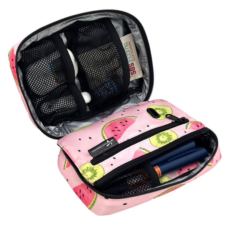 Pink insulated diabetes supply organizer with watermelon pattern containing black mesh pouch and items on a white background.